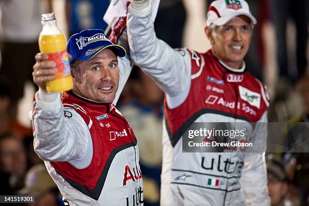 Tom Kristensen and Dindo Capello of Italy drivers of the Audi Sport Team Joest Audi R18 celebrate their overall victory during the 2012 World...