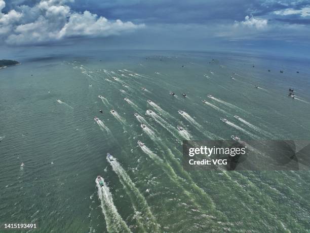 Aerial view of fishing boats setting sail to South China Sea for fishing on August 16, 2022 in Yangjiang, Guangdong Province of China. The seasonal...