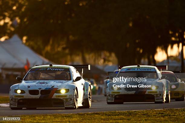 The BMW Team RLL BMW E92 M3 driven by Joey Hand of USA, Dirk Muller of Switzerland and Jonathan Summerton of USA leads the BMW Team RLL BMW E92 M3...