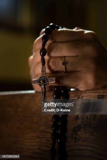 praying in church - crucifix stock pictures, royalty-free photos & images