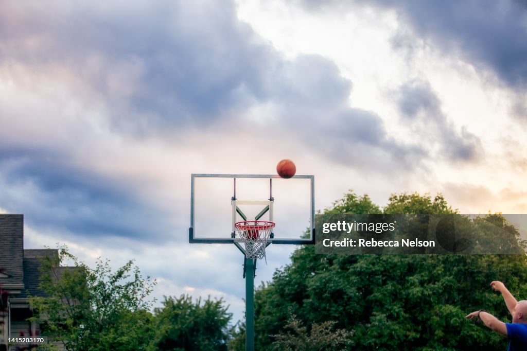 Basketball Being Shot Into A Basketball Hoop High-Res Stock Photo