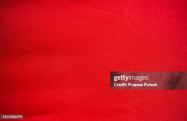 red fabric cloth polyester texture and textile background - polyester fotografías e imágenes de stock