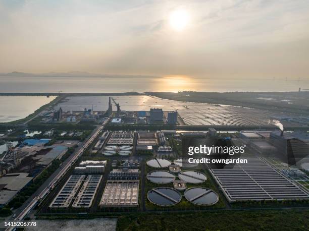 aerial view of sewage treatment plant at sunrise - 浄水 ストックフォトと画像