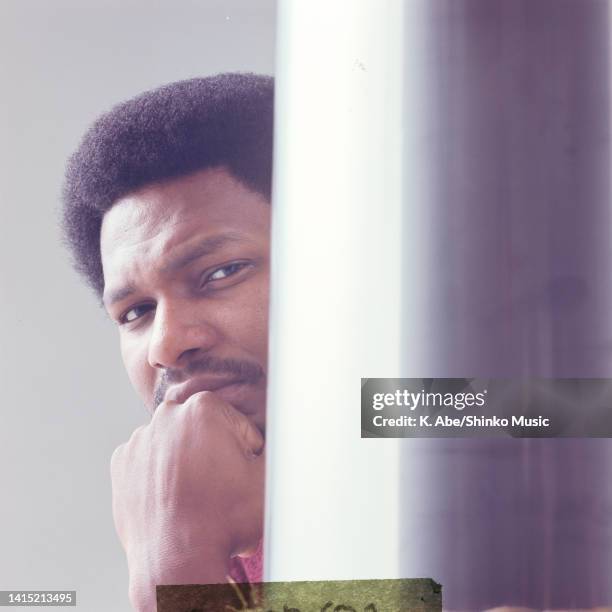 McCoy Tyner profile looking out from the silver column, location unknown, 27th October 1972.