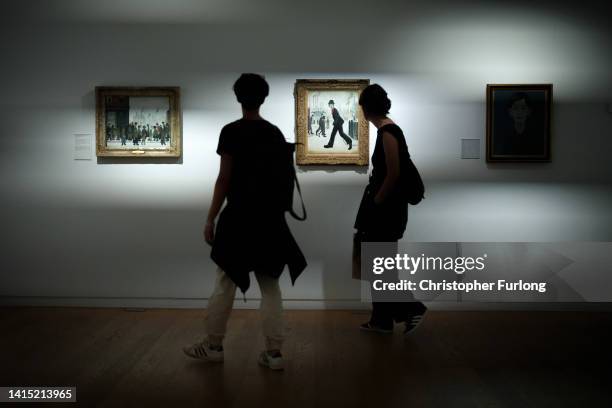 People view works by artist L.S. Lowry at Manchester Art Gallery on August 16, 2022 in Manchester, United Kingdom.