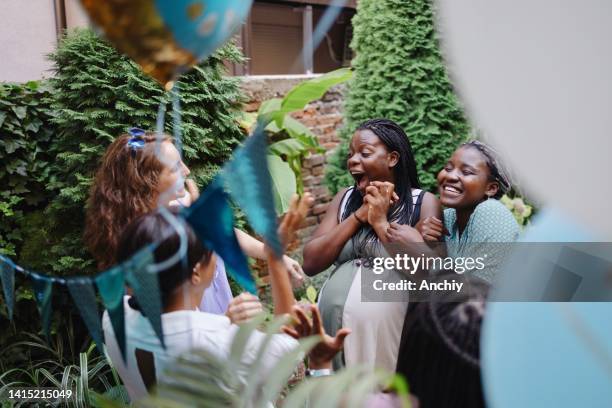 surprise baby shower party - baby shower stock pictures, royalty-free photos & images