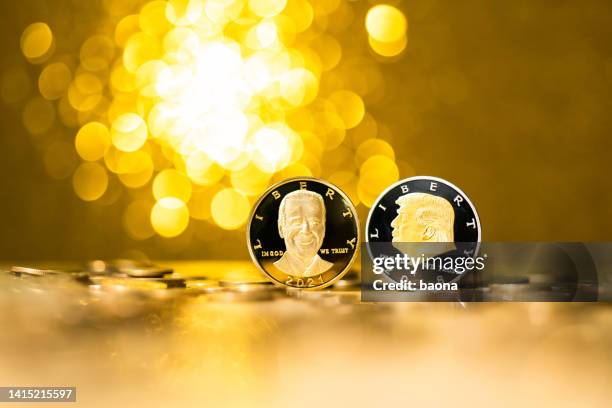 coins with donald trump and joseph biden - cash contest stock pictures, royalty-free photos & images