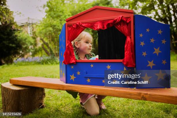 young girl with playhouse - puppet show stock pictures, royalty-free photos & images