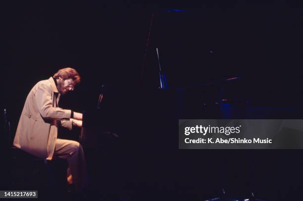 Bill Evans plays the piano with a jacket, Yubin Chokin Hall, Tokyo, Japan, 26 September 1978.