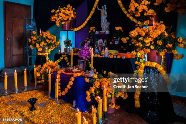 An altar of the dead , a religious site honoring the deceased, is placed inside a house during the Day of the Dead celebrations on November 2, 2021...