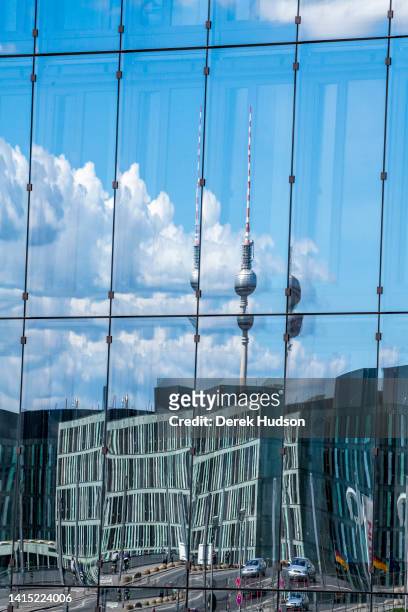 View, reflected in mirrored windows, of the Berliner Fernsehturm , among other buildings, Berlin, Germany, May 17, 2020. The windows are part of Cube...