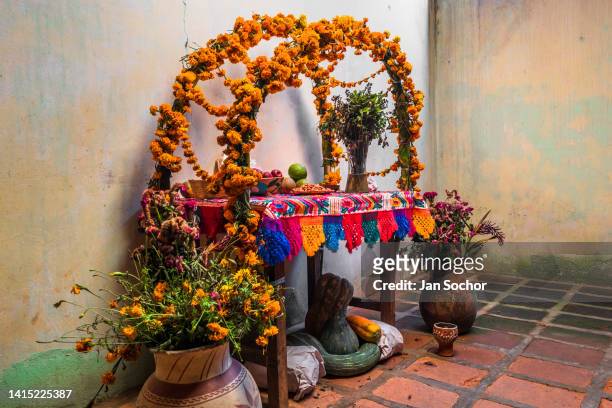 An altar of the dead , a religious site honoring the deceased, is placed inside a house during the Day of the Dead celebrations on November 5, 2021...