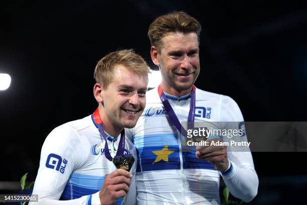 Gold medalists Theo Reinhardt and Roger Kluge of Germany pose on the podium during the Cycling Track - Men's Madison Final medal ceremony on day 6 of...
