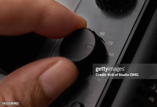 close-up view hand controlling the dial button - control dial stock pictures, royalty-free photos & images