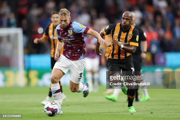 Charlie Taylor of Burnley is challenged by Oscar Estupinan of Hull City during the Sky Bet Championship between Burnley and Hull City at Turf Moor on...