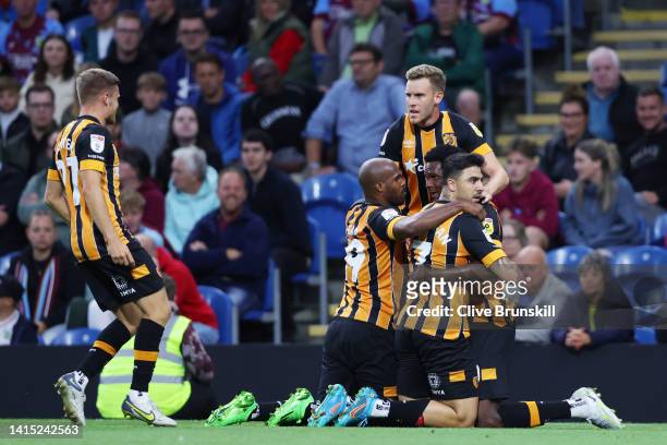 Ozan Tufan of Hull City celebrates with teammates after scoring their team's first goal during the Sky Bet Championship between Burnley and Hull City...