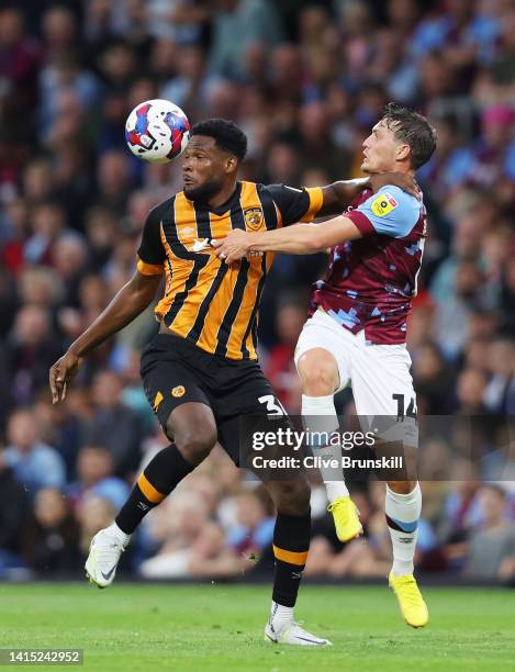 Benjamin Tetteh of Hull City is challenged by Connor Roberts of Burnley during the Sky Bet Championship between Burnley and Hull City at Turf Moor on...