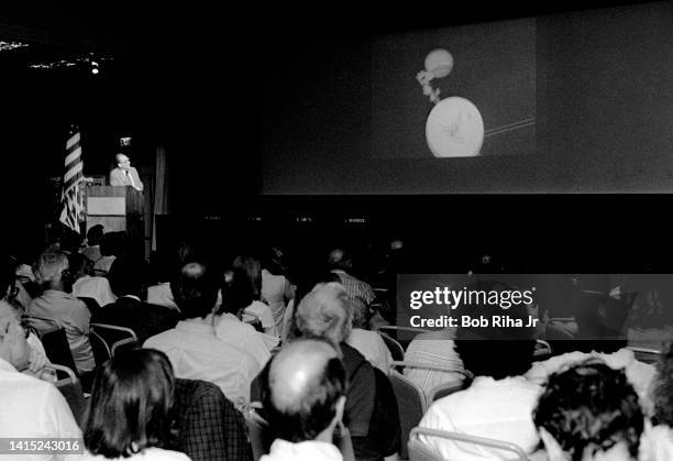 Dr. Edward Stone with NASA/JPL briefs reporters during press conference at NASA Jet Propulsion Laboratory during Voyager 2 and Neptune encounter,...