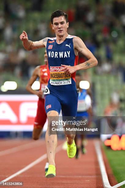 Gold medalist Jakob Ingebrigtsen of Norway celebrates at the finish line during the Athletics - Men's 5000m Final on day 6 of the European...