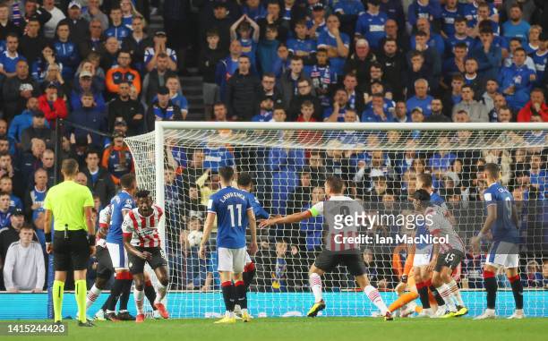 Ibrahim Sangare of PSV Eindhoven scores their team's first goal during the UEFA Champions League Play-Off First Leg match between Rangers FC and PSV...