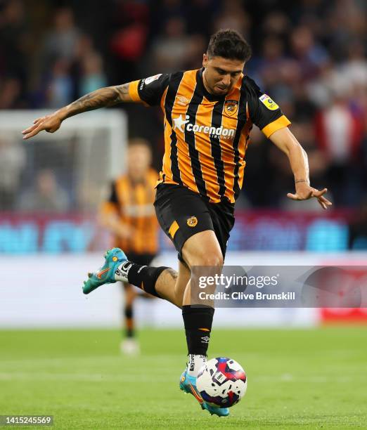 Ozan Tufan of Hull City runs with the ball during the Sky Bet Championship between Burnley and Hull City at Turf Moor on August 16, 2022 in Burnley,...