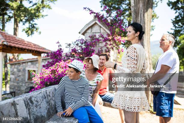 a tour guide talking to a group of tourists - church group stock pictures, royalty-free photos & images