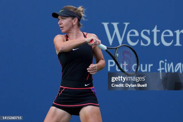 Simona Halep of Romania plays a forehand during her match against Anastasia Potapova of Russia during the Western & Southern Open at the Lindner...
