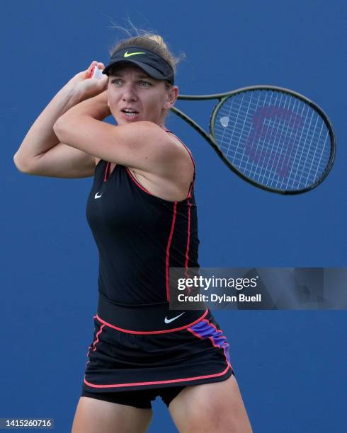 Simona Halep of Romania plays a backhand during her match against Anastasia Potapova of Russia during the Western & Southern Open at the Lindner...