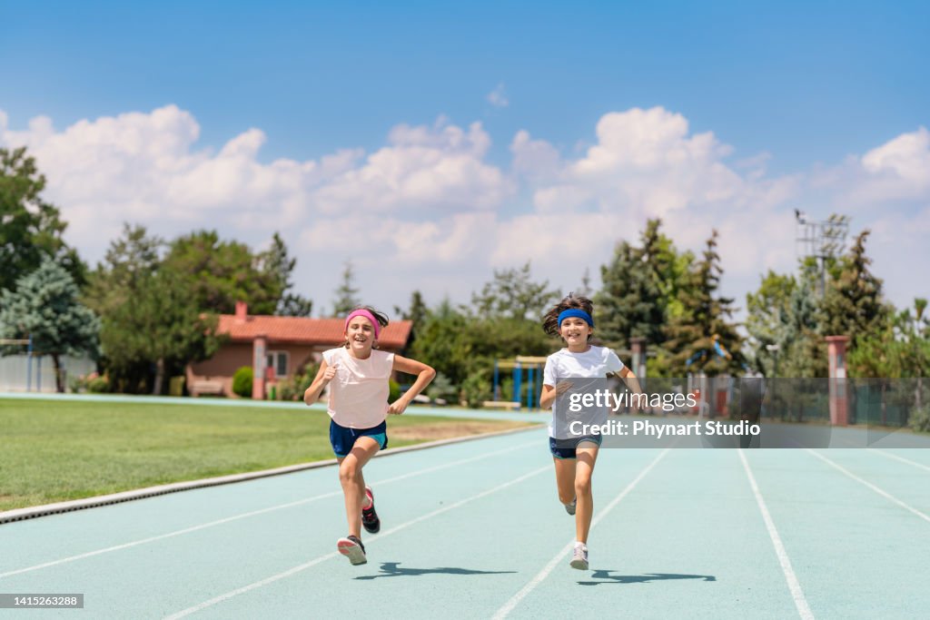 Track Racer Kids Kids Running A Track Race High-Res Stock Photo - Getty Images