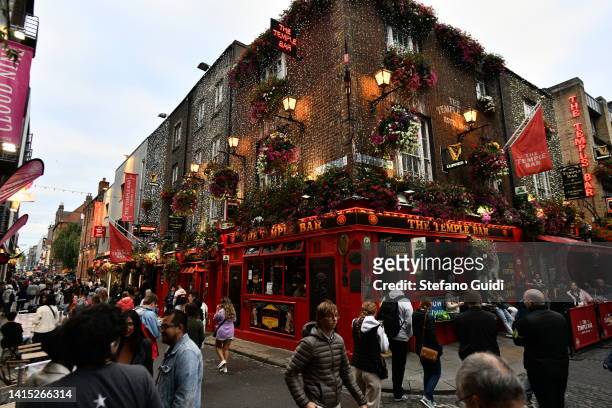 General view of tourists walking near The Temple Bar on August 16, 2022 in Dublin, Ireland. Dublin is the capital of the Republic of Ireland, is...
