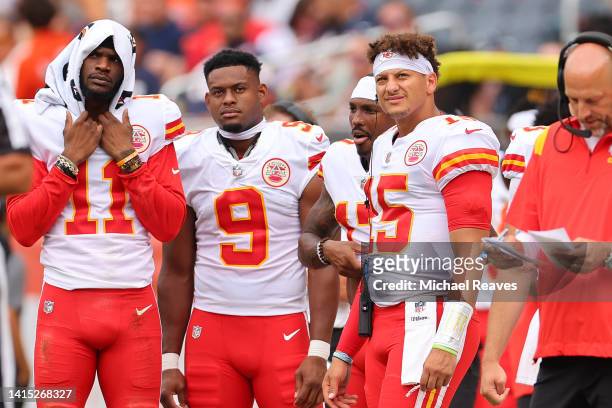Marquez Valdes-Scantling, JuJu Smith-Schuster, and Patrick Mahomes look on against the Chicago Bears during the first half of the preseason game at...