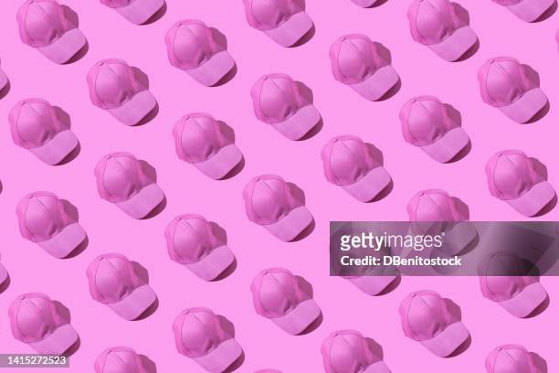 pattern of pink caps to support the fight against breast cancer, on a pink background. concept of breast cancer, disease, fight, chemotherapy, hope, death and woman. - pink hat stock pictures, royalty-free photos & images