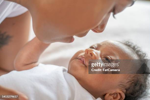 african infant and mother intimate moment - eating human flesh stock pictures, royalty-free photos & images