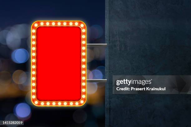 red shining marquee empty banner on dark concrete wall - las vegas sign stockfoto's en -beelden