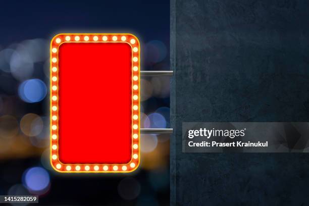 red shining marquee empty banner on dark concrete wall - rectangle logo stock pictures, royalty-free photos & images