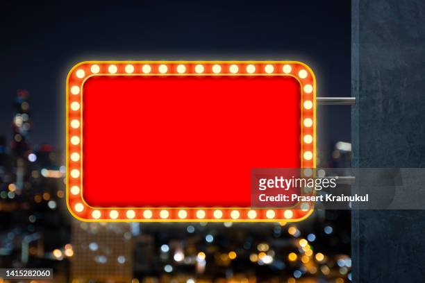 red shining marquee empty banner on dark concrete wall - las vegas sign stockfoto's en -beelden