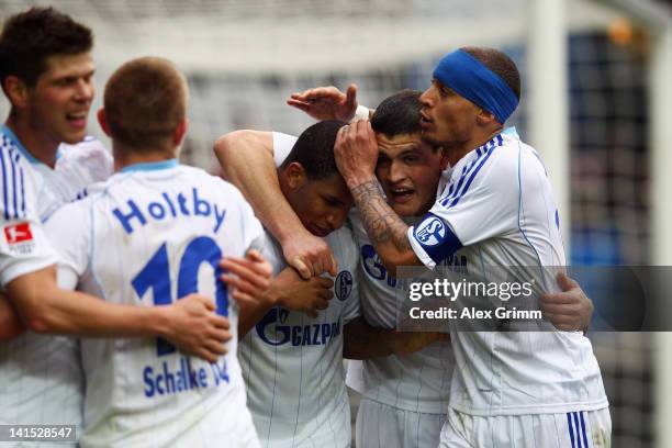 Jefferson Farfan of Schalke celebrates his team's fourth goal with team mates Klaas-Jan Huntelaar, Lewis Holtby, Kyriakos Papadopoulos and Jermaine...