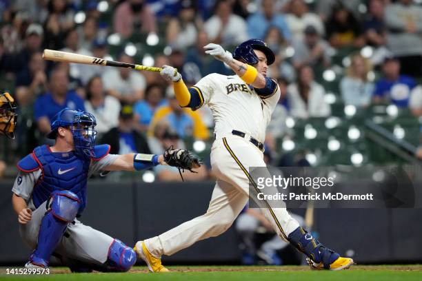 Victor Caratini of the Milwaukee Brewers hits a walk-off two RBI single against the Los Angeles Dodgers in the 11th inning at American Family Field...