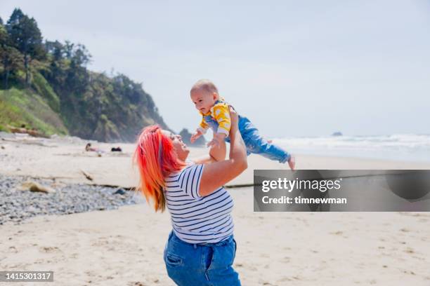 loving life on the beach - rockaway beach stock pictures, royalty-free photos & images