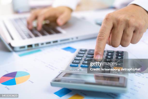 businessman accounting - accounting calculator stock pictures, royalty-free photos & images