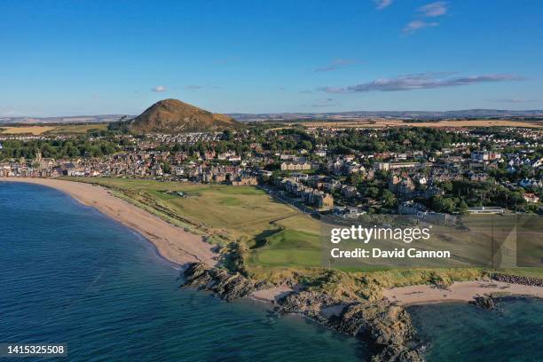 An aerial view of the first and 18th holes at North Berwick Golf Club with the town of North Berwick behind on August 04, 2022 in North Berwick,...
