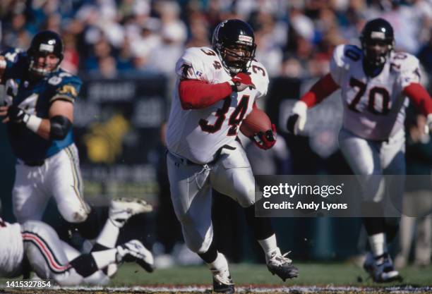 Craig Heyward, Running Back for the Atlanta Falcons in motion carrying the football during the American Football Conference Central Division game...