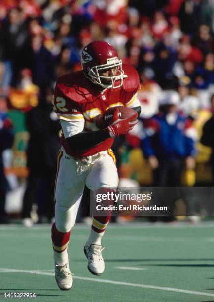 Marcus Allen, Running Back for the Kansas City Chiefs in motion carrying the football during the American Football Conference Wild Card game against...