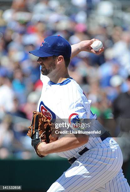 Randy Wells of the Chicago Cubs pitches against the Milwaukee Brewers at HoHokam Stadium on March 14, 2012 in Mesa, Arizona.