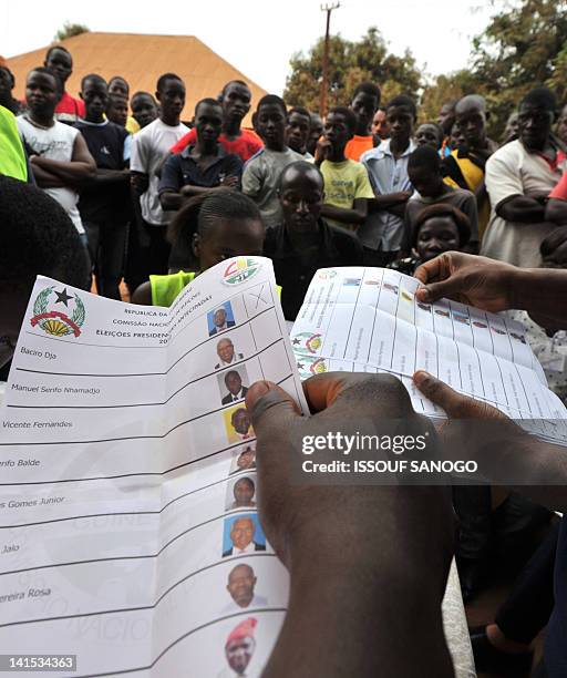 Electoral offciers count ballot papers at the polling station on March 18, 2012 in Bissau. Two leading presidential candidates criticised the...