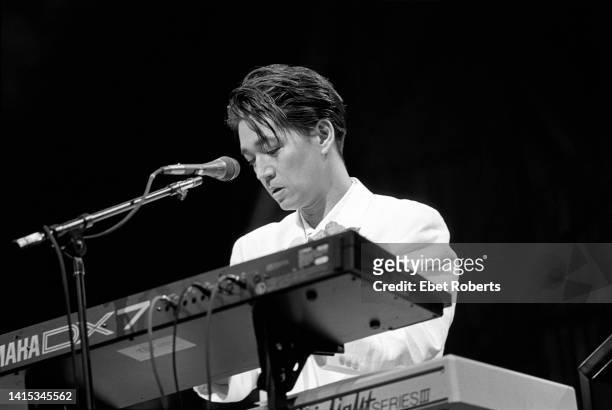 Ryuichi Sakamoto performing at the Beacon Theatre in New York City on June 24, 1988.He is playing a Yamaha DX-7 synthesiser.