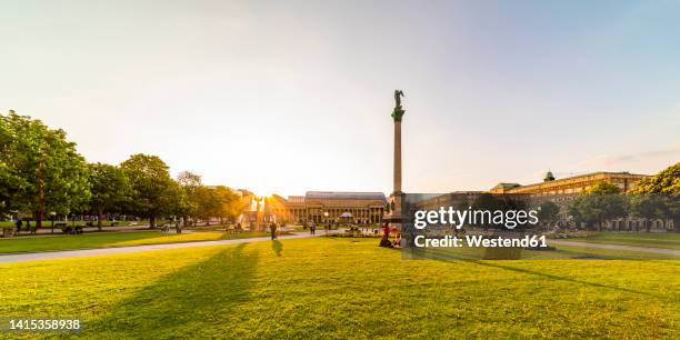 germany, baden-wurttemberg, stuttgart, lawn in front of schlossplatz at sunset - stuttgart stock-fotos und bilder