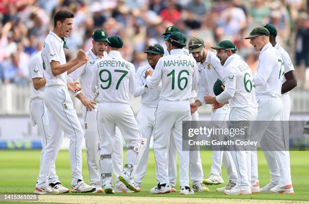 Marco Jansen of South Africa celebrates with teammates afterdismissing Joe Root of England during day one of the First LV= Insurance Test Match...