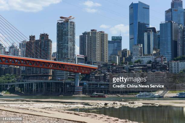 The Jialing River bed is exposed due to drought on August 17, 2022 in Chongqing, China. The water level of the Jialing River, one of the tributaries...