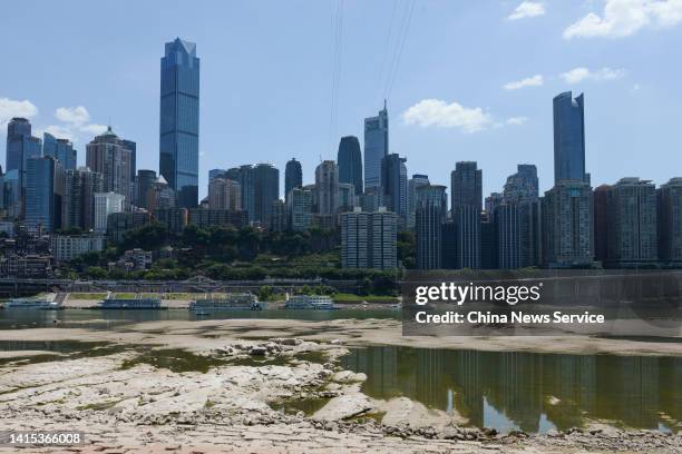 The Jialing River bed is exposed due to drought on August 17, 2022 in Chongqing, China. The water level of the Jialing River, one of the tributaries...